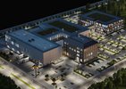 Blick von oben auf einen Firmensitz mit Bürogebäude, Parkhaus und Parkplätzen, Lager mit Lkw-Ladestationen